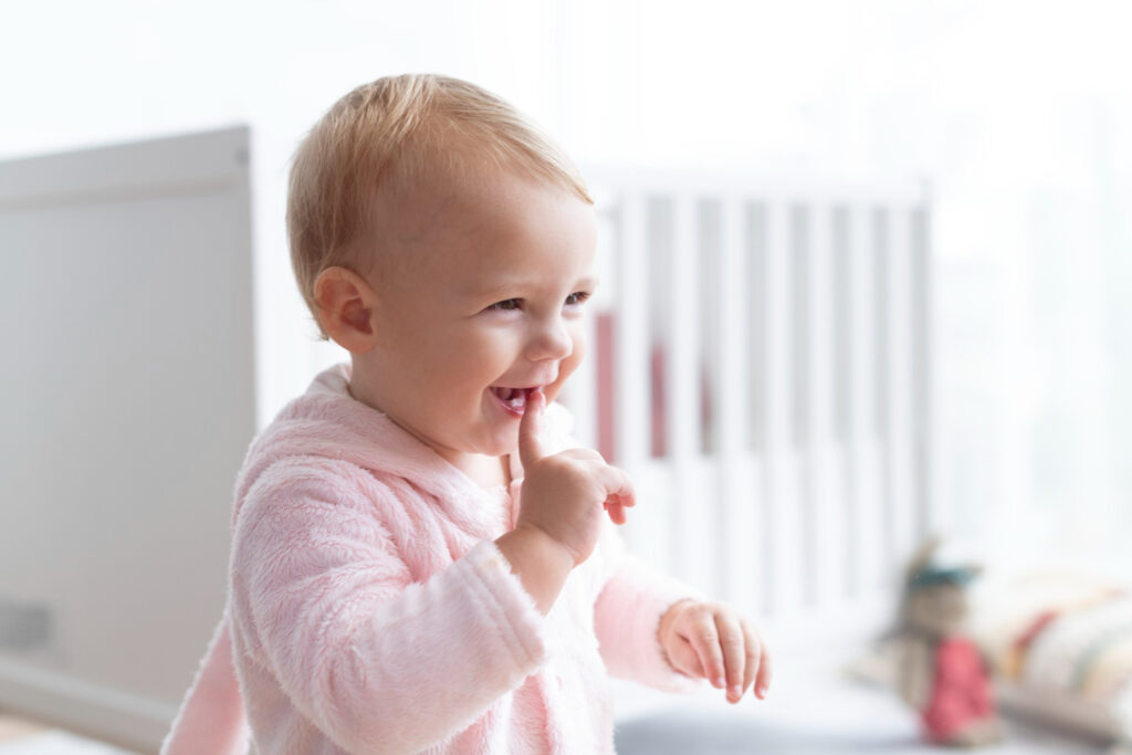 cute baby girl smiling her nursery 1024x683 - Preventing Infant Tooth Decay: The Power of Formulated Milk